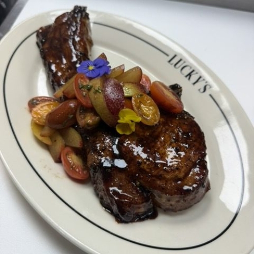 Chef Ricardo Herrera @ Lucky&rsquo;s Steak House DTLA Beeler&rsquo;s Heritage Pork Tomahawk&nbsp;- black pepper molasses w/ Tomatoe and plum relish.